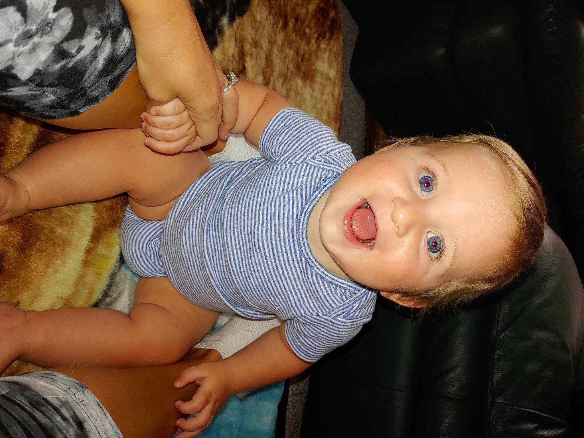 Easton is registered to the contest to win money with this photo: baby_toddler_clothing, cheek, facial_expression, finger, fun, gesture, hand, happy, human_body, iris, joint, leg, lip, mouth, muscle, nose, person, skin, smile, thumb