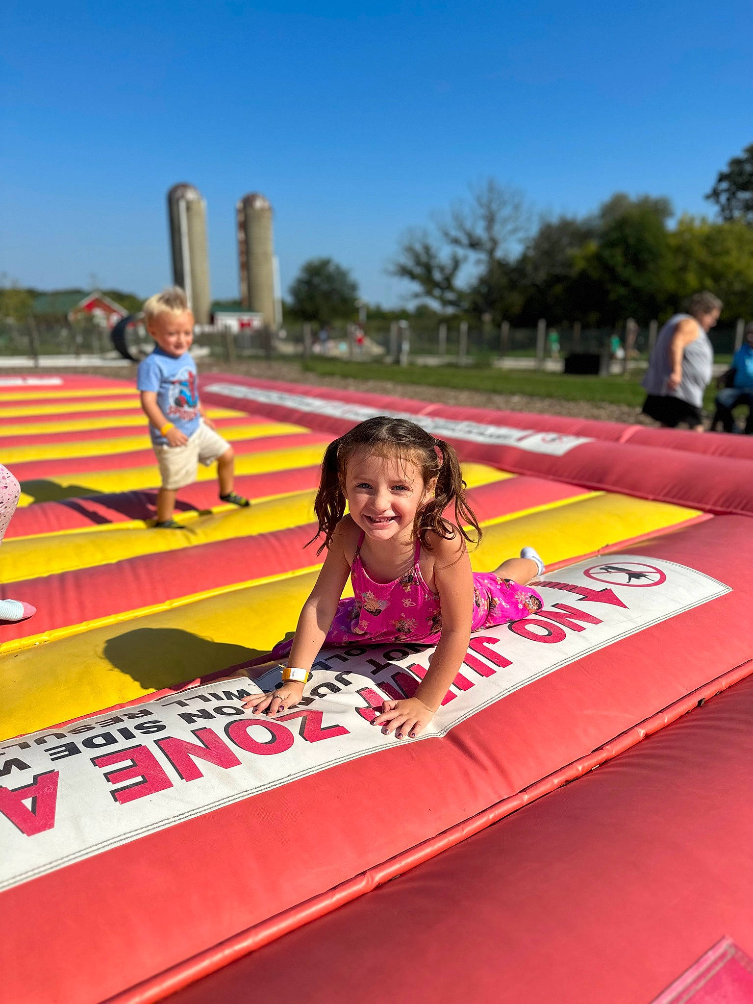 Emersyn is registered to the contest to win money with this photo: blurred, child, competition, competition_event, event, fun, games, grass, happy, joy, leisure, magenta, person, pink, play, public_event, recreation, sky, smile, sports