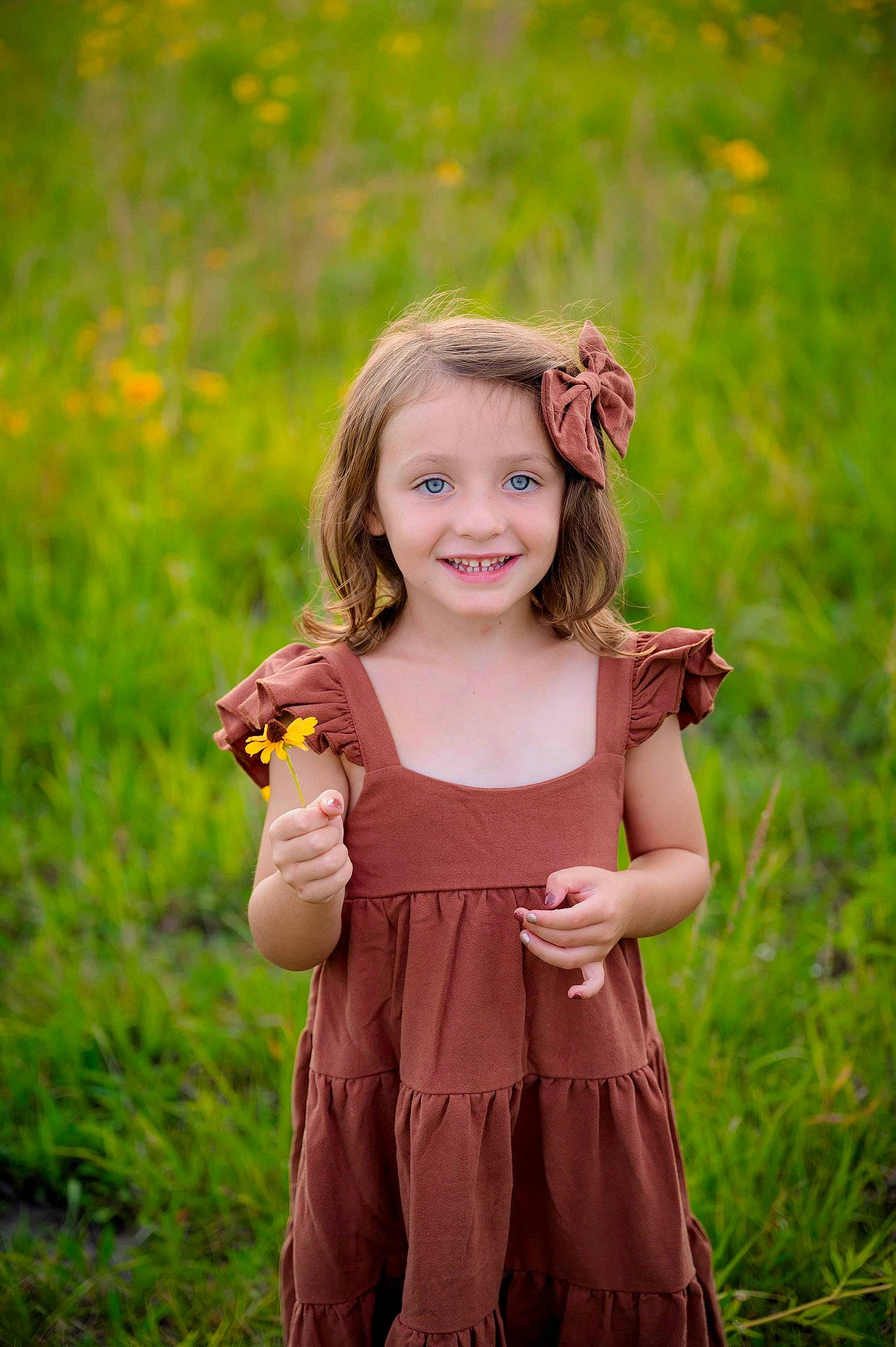 Emersyn is registered to the contest to win money with this photo: day_dress, dress, eye, finger, flash_photography, fun, gesture, grass, grassland, hair, hand, happy, joy, meadow, one_piece_garment, people_in_nature, person, plant, shoulder, smile