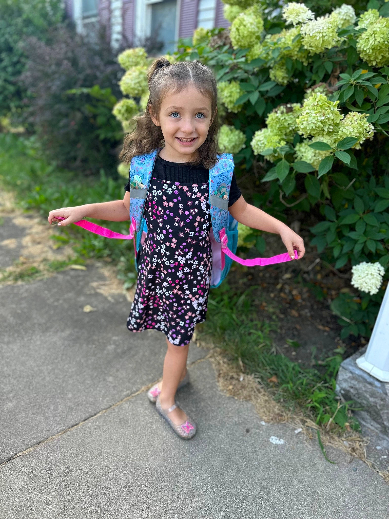 Emersyn is registered to the contest to win money with this photo: annual_plant, asphalt, baby_toddler_clothing, botany, child, fun, garden, grass, happy, joy, leisure, magenta, people_in_nature, person, pink, plant, sandal, shrub, smile, toddler