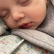 Ilyane participe au concours pour gagner de l'argent avec cette photo : baby, sleeping, close_up, face, soft, fabric, floral_pattern, peaceful, infant, skin, eyelashes, lips, blanket, cute, portrait, newborn, comfort, rest, child, toddler