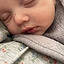 baby, sleeping, close_up, face, soft, fabric, floral_pattern, peaceful, infant, skin, eyelashes, lips, blanket, cute, portrait, newborn, comfort, rest, child, toddler
