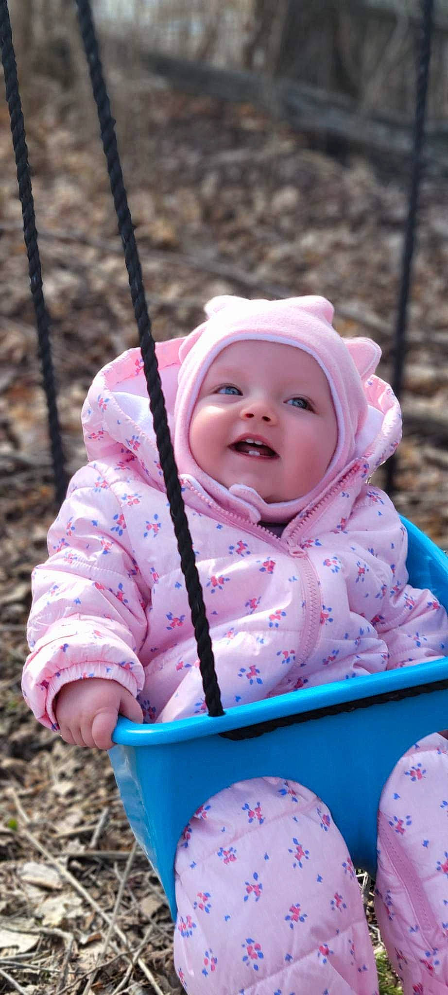 Haley is registered to the contest to win money with this photo: baby, baby_toddler_clothing, blue, cheek, child, face, fun, grass, green, happy, headwear, leisure, people_in_nature, person, photograph, pink, product, sleeve, smile, toddler