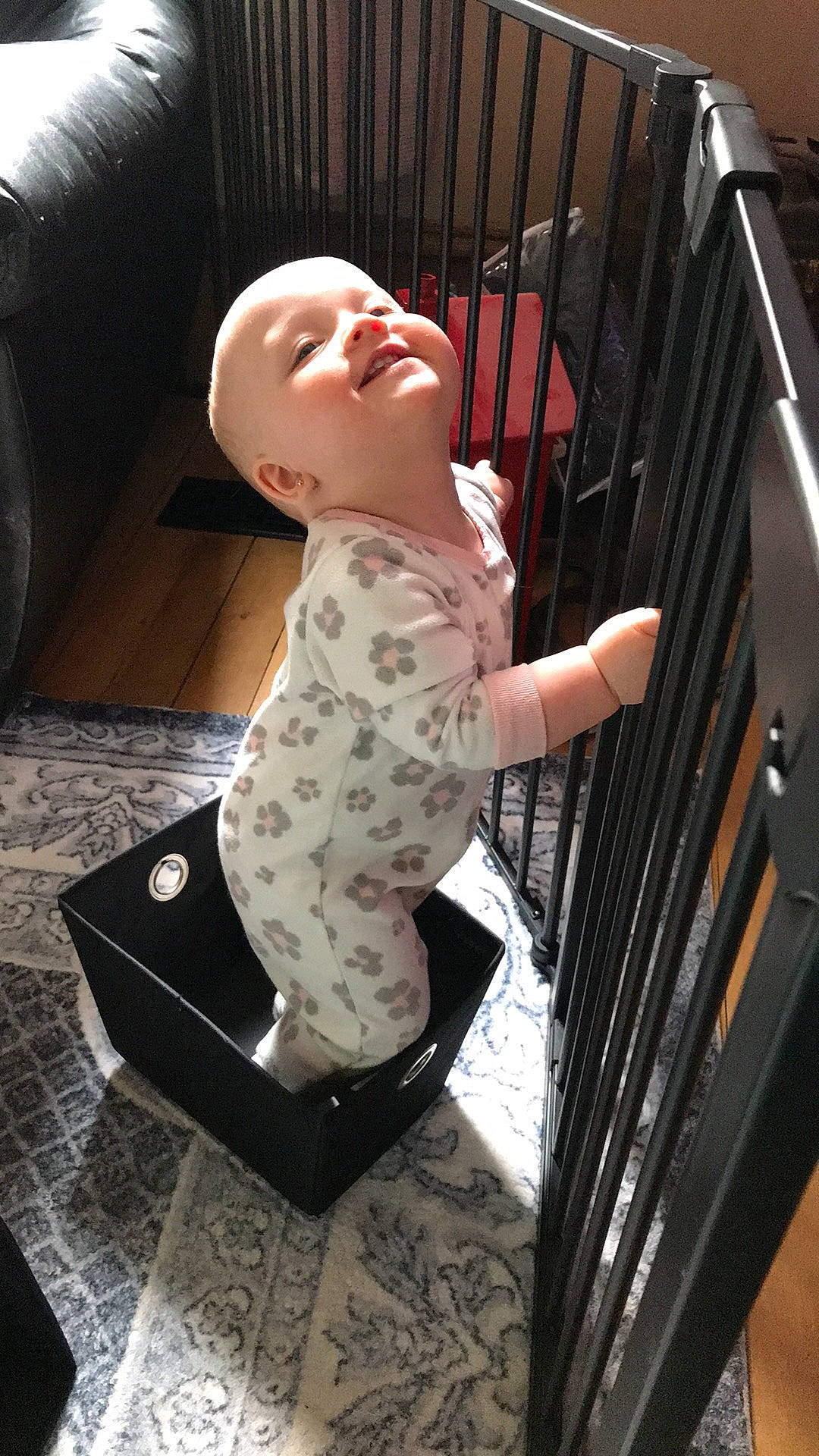 Haley is registered to the contest to win money with this photo: baby, baby_products, baby_safety, baby_toddler_clothing, child, comfort, design, floor, flooring, handrail, human_body, human_leg, knee, pattern, sitting, sleeve, smile, thigh, toddler, wood
