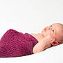 Maddie a rejoint le concours — aidez-le/la à gagner de superbes lots ! baby, blanket, cozy, cute, ear, eyes_open, face, hand, head, infant, lying_down, newborn, peaceful, portrait, purple_wrap, soft_texture, studio, swaddle, white_background, wrinkled_skin
