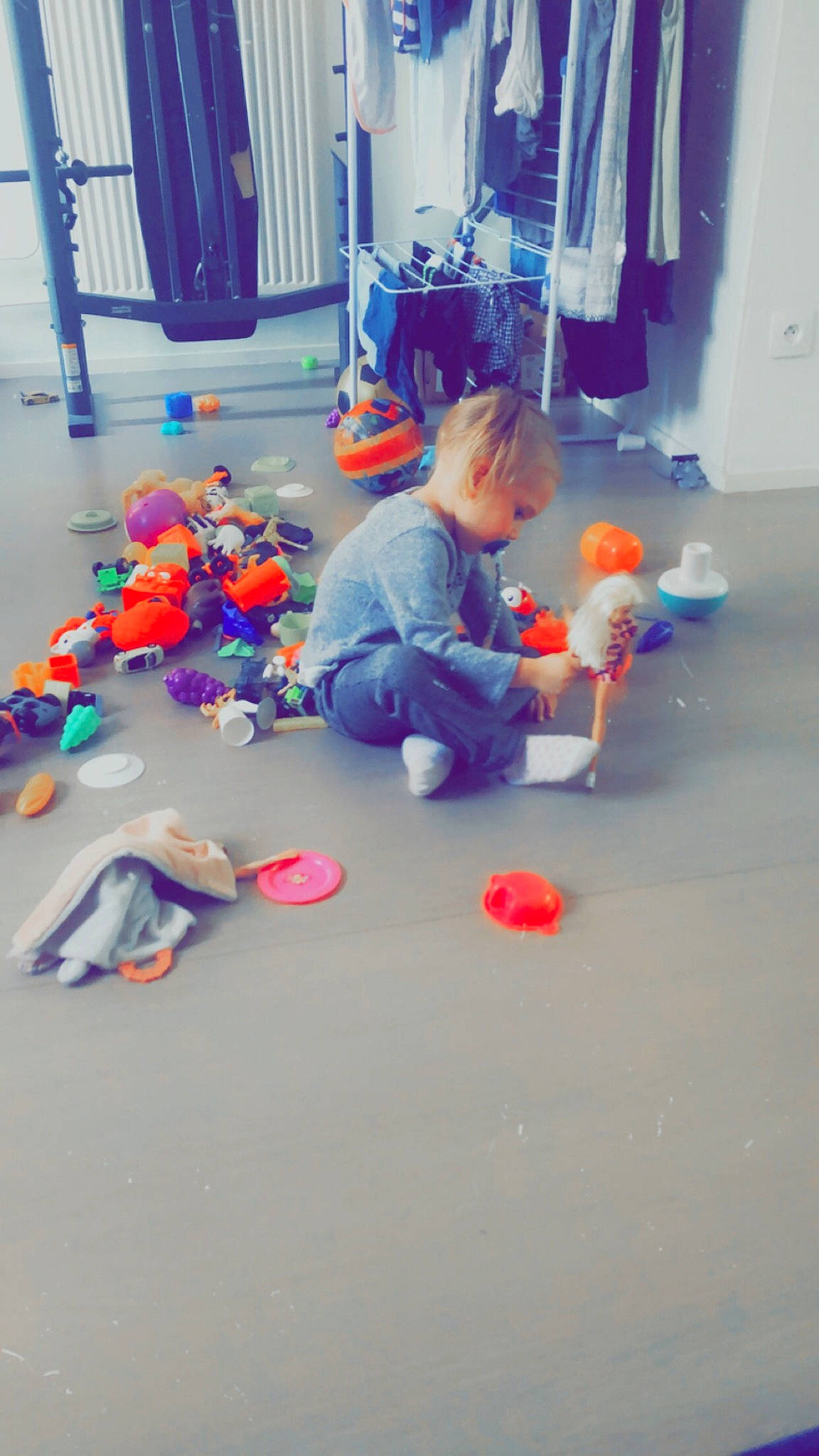 Leanne participe au concours pour gagner de l'argent avec cette photo : child, cleanliness, concrete, curtain, door, electric_blue, event, floor, flooring, fun, kindergarten, leisure, orange, party_supply, person, plastic, play, room, sitting, toddler