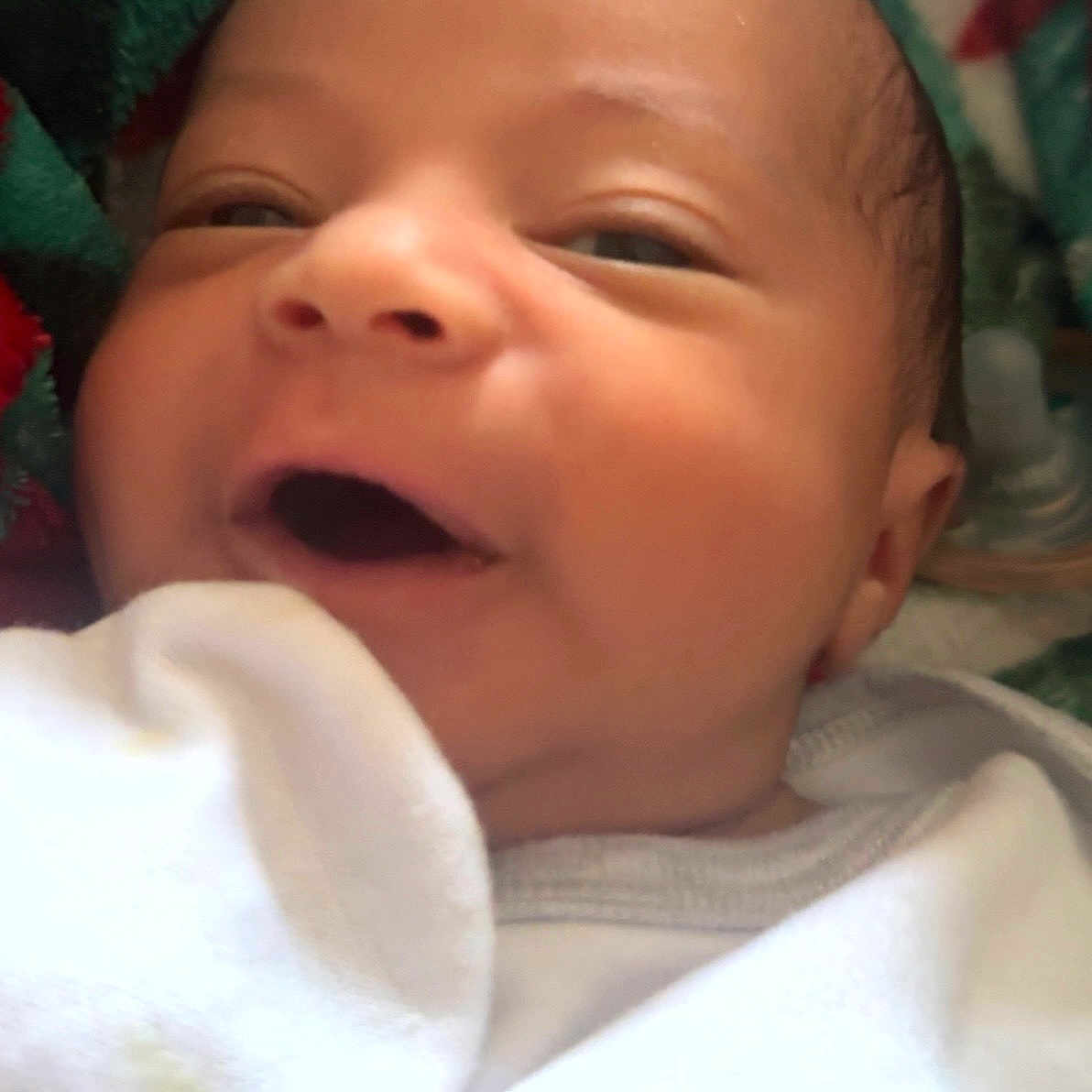 Raiden joined the competition — help win amazing prizes! baby, infant, smiling, close_up, face, newborn, blanket, white_clothing, happy, cute, child, portrait, indoors, skin, head, expression, mouth_open, eyes, young, cozy