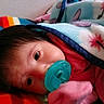 Destiny joined the competition — help win amazing prizes! baby, pacifier, blanket, colorful, striped, closeup, face, infant, child, pink_clothing, blue_blanket, soft_texture, lying_down, indoors, cute, warm, comfort, sleepy, portrait, toddler