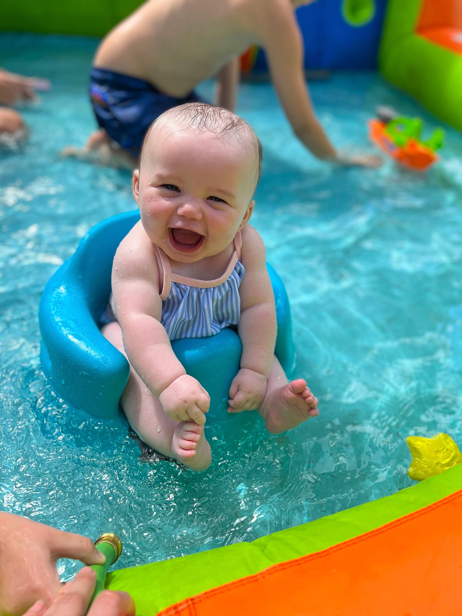 Annalise joined the competition — help win amazing prizes! aqua, azure, baby, blue, child, fun, green, happy, leisure, outdoor_recreation, person, photograph, product, recreation, red, smile, summer, swimming_pool, toddler, water