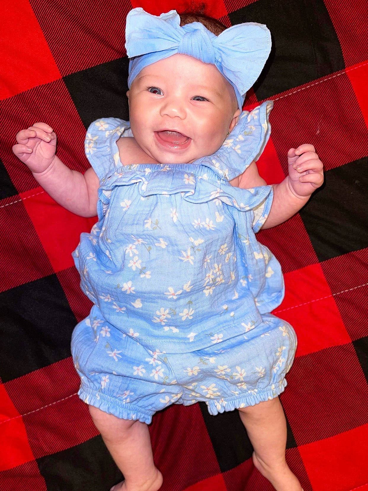 Annalise joined the competition — help win amazing prizes! baby, baby_toddler_clothing, blue, cheek, clothing, face, fun, hand, happy, headwear, human_body, iris, person, pink, purple, red, skin, sleeve, smile, tartan