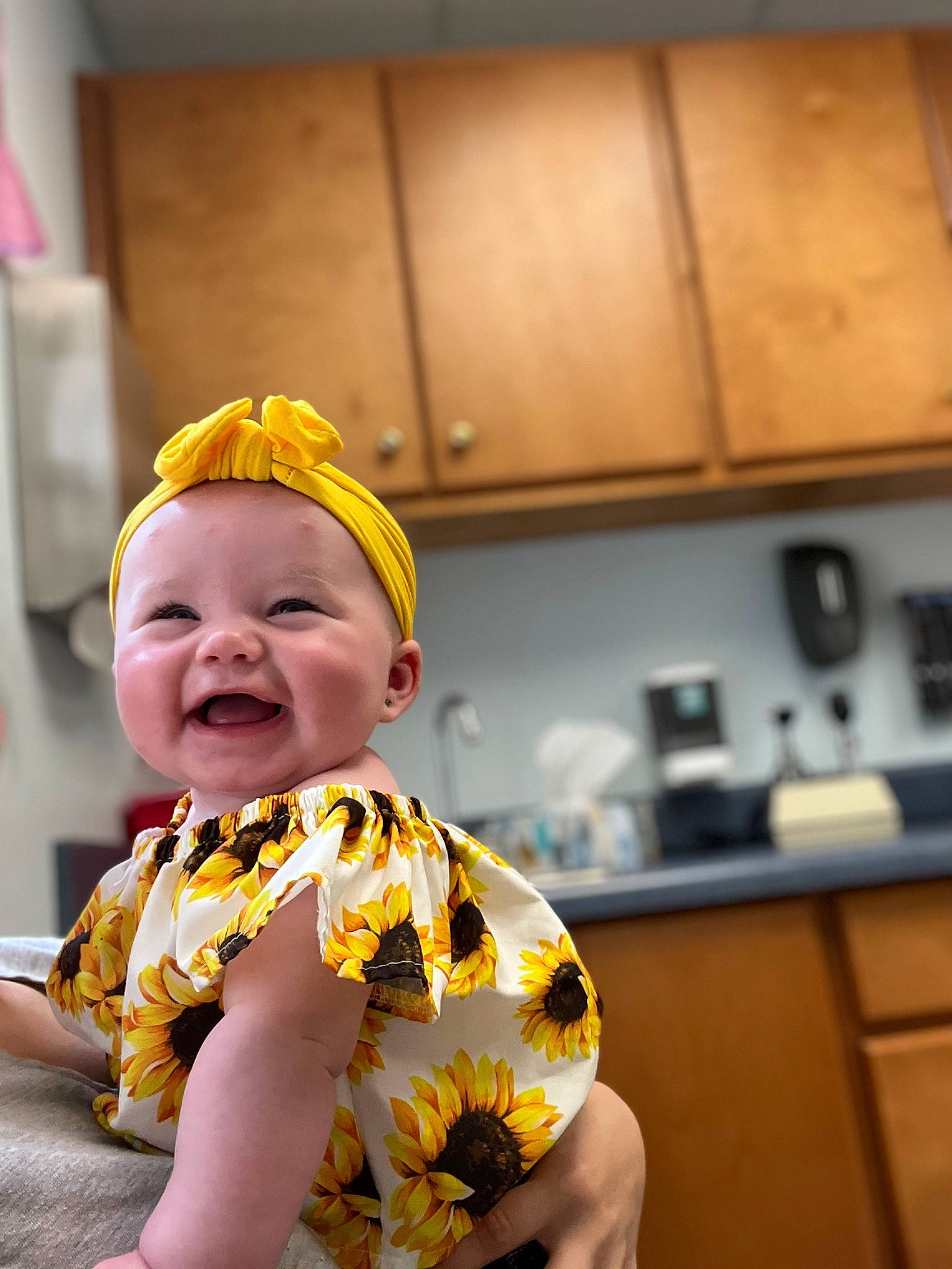 Annalise is registered to the contest to win money with this photo: baby, baby_laughing, baby_toddler_clothing, cabinetry, child, cooking, countertop, drawer, event, fun, happy, hat, headwear, home_appliance, kitchen, kitchen_appliance, party_supply, person, recipe, room