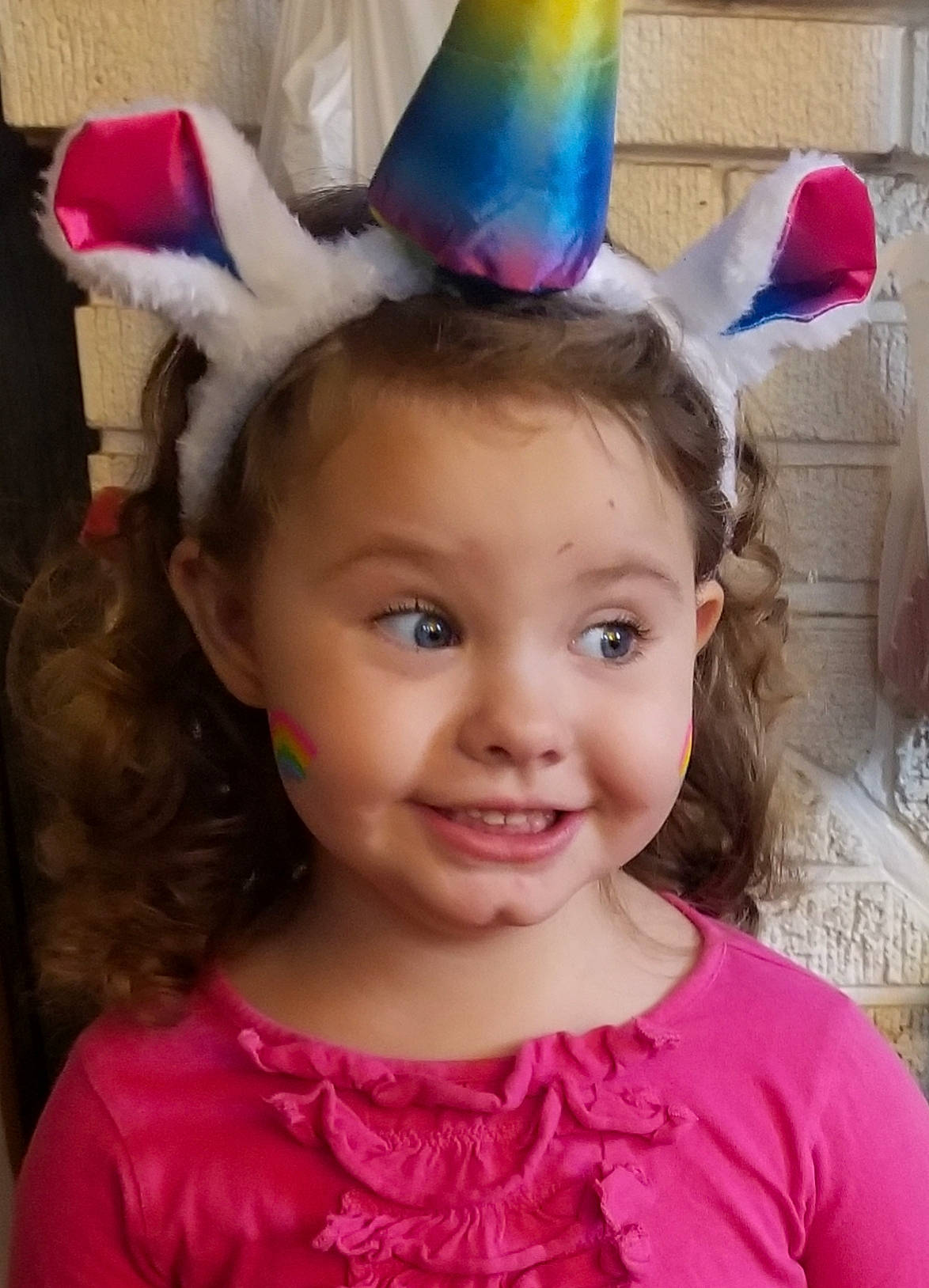 Jillian is registered to the contest to win money with this photo: child, ear, fashion_accessory, hair_accessory, head, headband, headgear, joy, organ, party_hat, person, pink, toddler