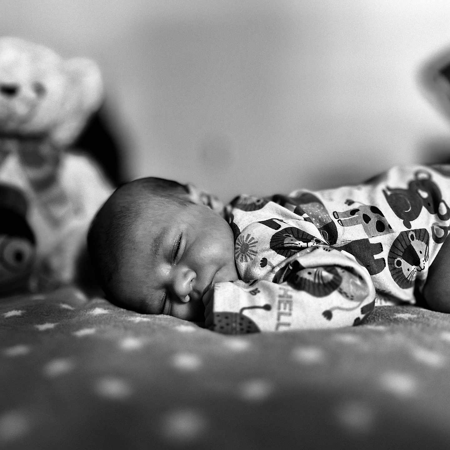 Princeton is registered to the contest to win money with this photo: baby, sleeping, pajamas, blanket, stuffed_toy, teddy_bear, soft_focus, cute, infant, cozy, monochrome, portrait, child, peaceful, rest, indoors, sleep, baby_clothes, animal_print, comfort