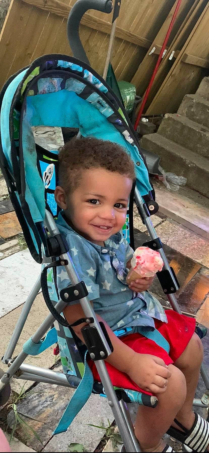 Steffon is registered to the contest to win money with this photo: auto_part, baby, baby_carriage, baby_products, blue, child, electric_blue, fun, joy, leisure, people, person, photograph, product, recreation, skin, smile, snapshot, toddler, travel