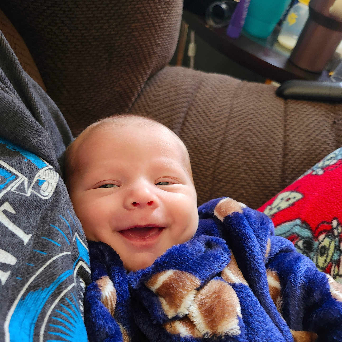 Theodore is registered to the contest to win money with this photo: baby, blanket, car, car_interior, carseat, couch, cup, cushion, face, furniture, head, homedecor, newborn, person, photography, portrait, quilt, towel, transportation, vehicle