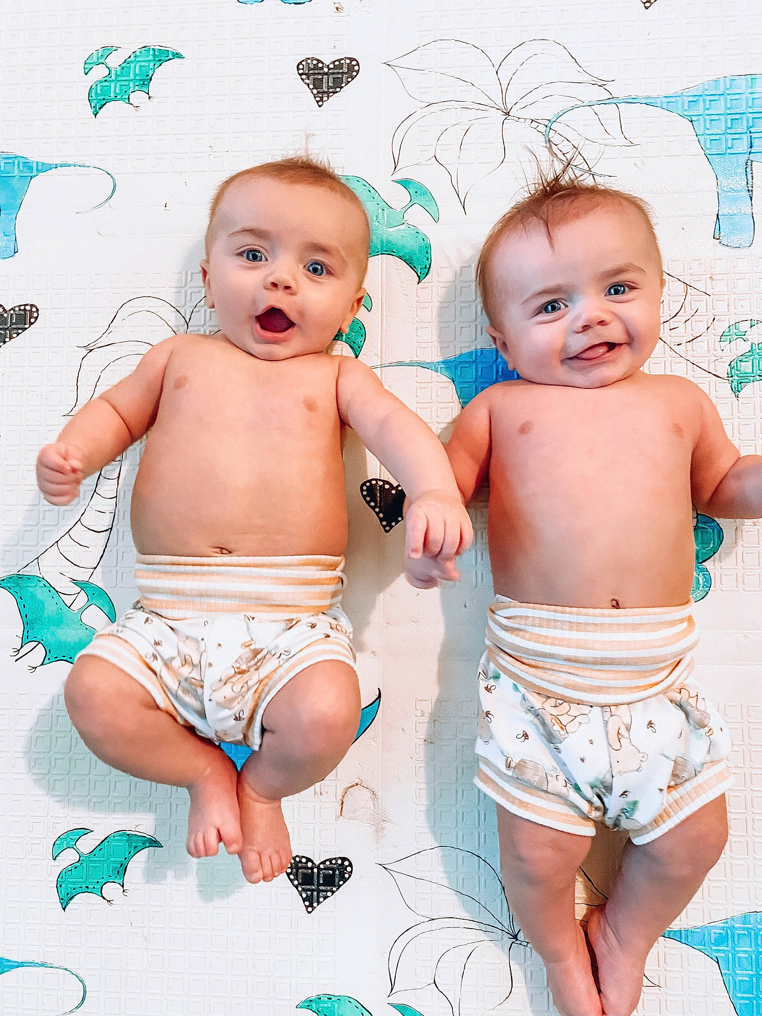 Archer And Atticus is registered to the contest to win money with this photo: baby, baby_toddler_clothing, blue, cheek, eye, face, facial_expression, finger, happy, human, human_body, iris, joy, leg, mouth, muscle, neck, organ, person, product