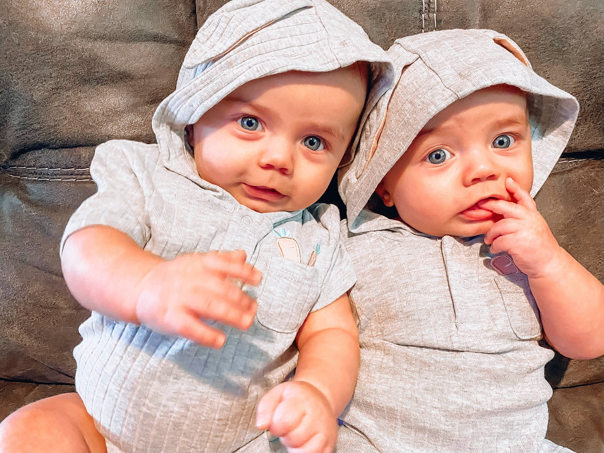 Archer And Atticus is registered to the contest to win money with this photo: baby, baby_toddler_clothing, cap, cheek, child, fashion_accessory, fun, gesture, grass, happy, hat, headgear, headwear, interaction, lip, nose, person, plant, skin, sleeve