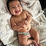 Mateo joined the competition — help win amazing prizes! baby, smiling, diaper, blanket, toy, infant, cute, happy, chubby, hand, foot, skin, lying_down, indoors, child, play, comfort, expression, face, closeup