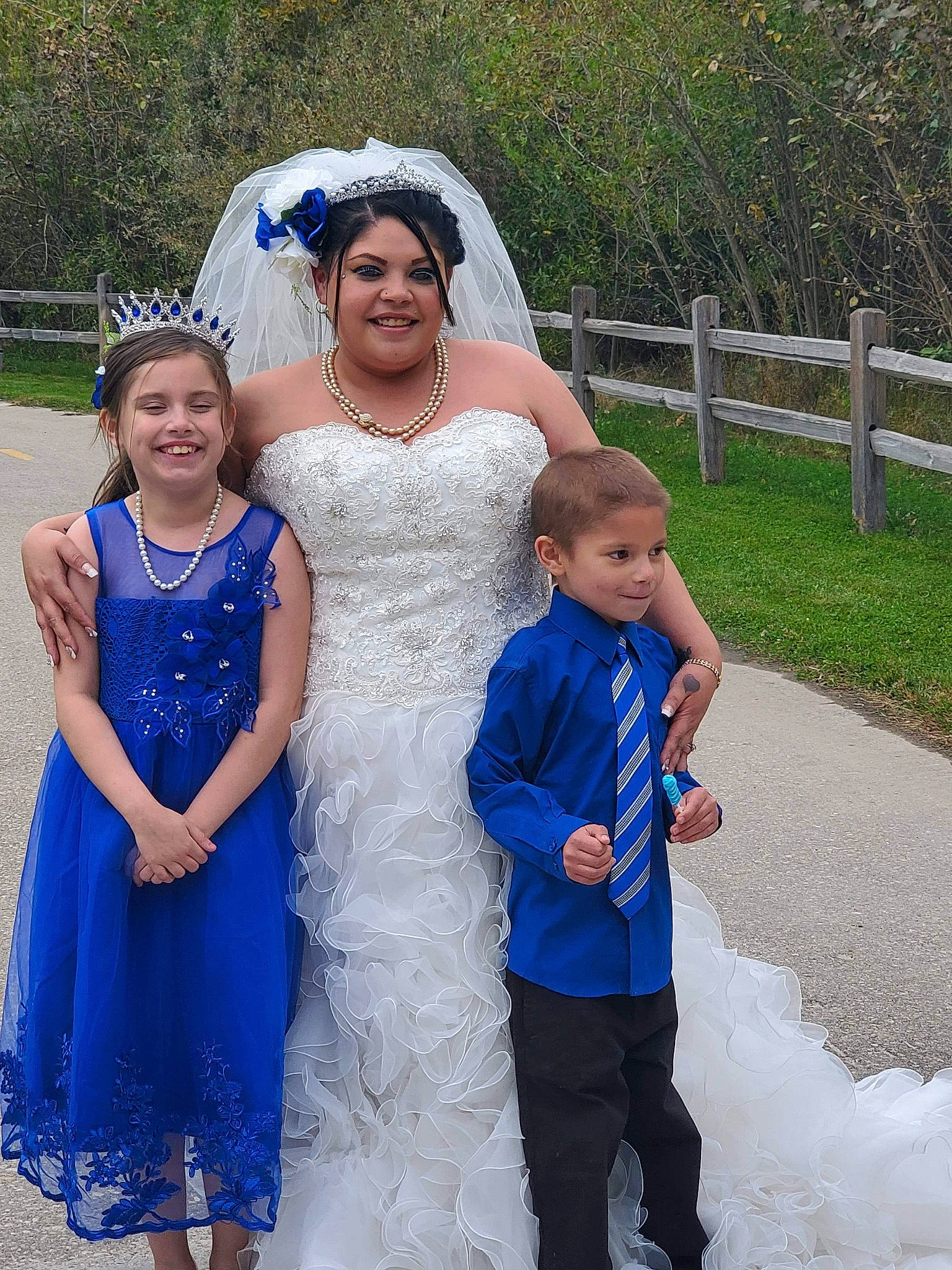 Myah is registered to the contest to win money with this photo: blue, bridal_accessory, bridal_clothing, bridal_party_dress, bride, ceremony, child, clothing, dress, event, facial_expression, formal_wear, fun, gown, happy, headwear, interaction, joy, person, photograph