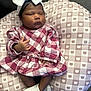 Kehlani is registered to the contest to win money with this photo: baby, infant, sleeping, headband, bow, dress, checkered_pattern, socks, cushion, bear_pattern, pink, white, cozy, comfortable, child, portrait, indoors, cute, peaceful, resting