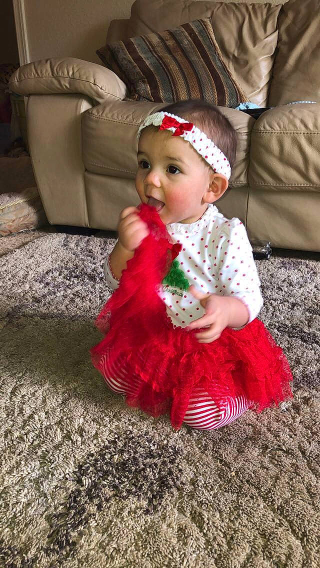 Harmony joined the competition — help win amazing prizes! baby, baby_toddler_clothing, child, child_model, christmas, clothing, costume, dress, fur, headgear, person, red, sitting, smile, toddler