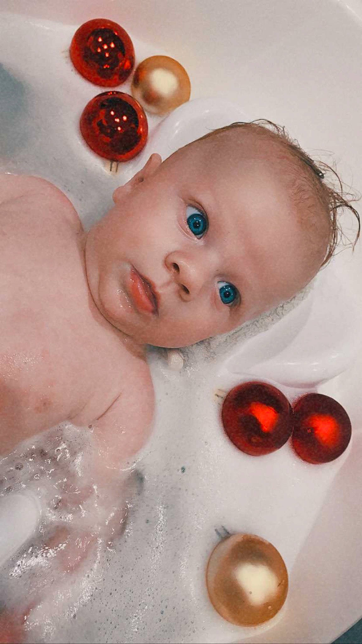 Haron participe au concours pour gagner de l'argent avec cette photo : baby, baby_toddler_clothing, bathing, brown, cheek, child, iris, lip, organ, peach, person, portrait_photography, skin, still_life_photography, tan