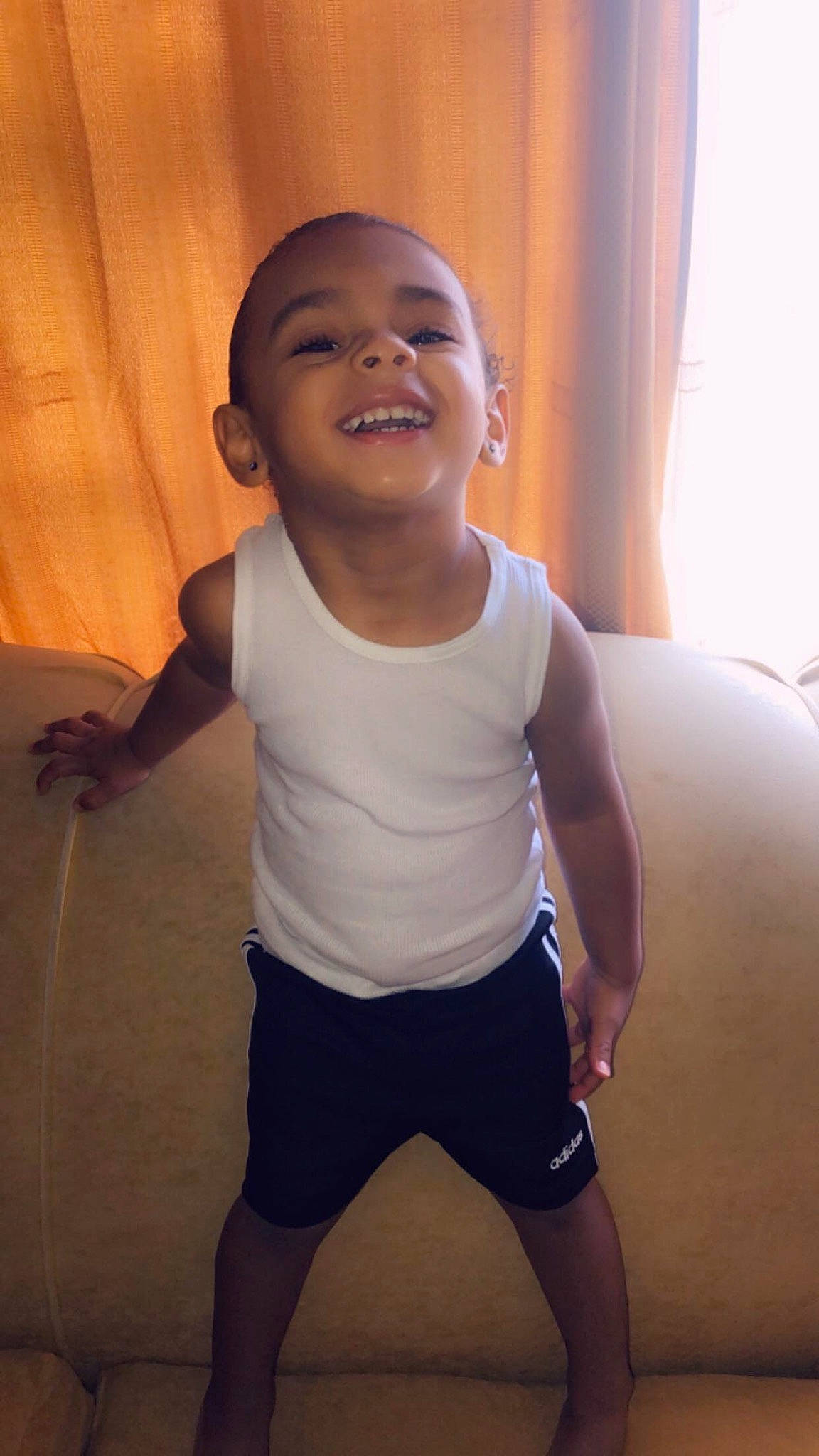 Marcello is registered to the contest to win money with this photo: arm, cheek, child, face, facial_expression, fun, happy, head, joint, joy, laugh, leg, muscle, nose, person, shoulder, skin, smile, standing, t_shirt