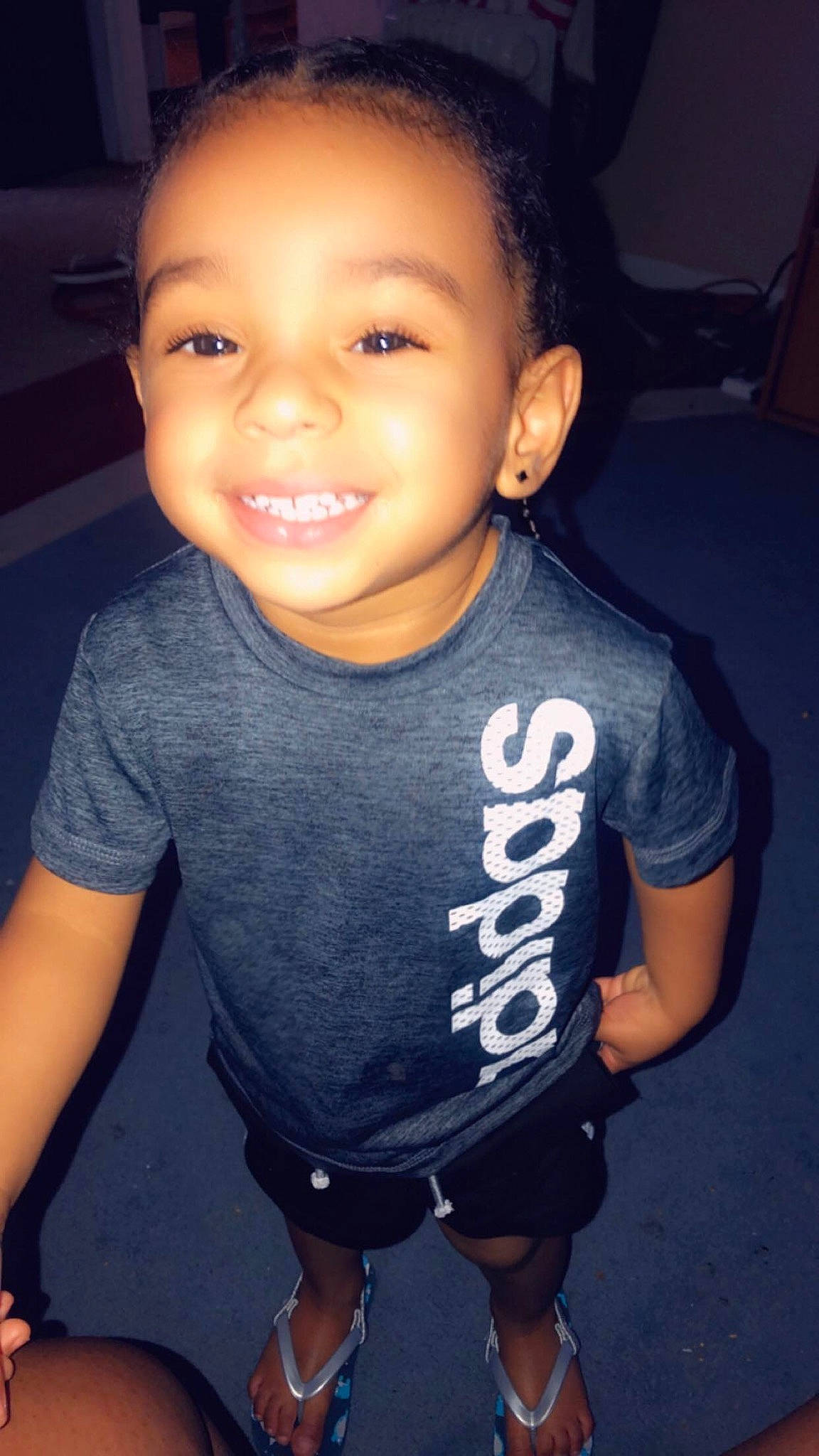 Marcello is registered to the contest to win money with this photo: black_hair, cheek, child, chin, cool, face, facial_expression, forehead, fun, hairstyle, happy, head, joy, person, skin, smile, standing, t_shirt, toddler