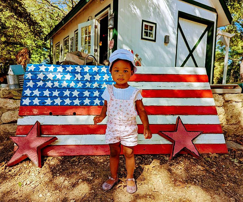 Zariyah is registered to the contest to win money with this photo: bench, child, fun, grass, house, leaf, leisure, morning, nature, outdoor_bench, outdoor_furniture, person, plant, public_space, recreation, shorts, summer, tints_and_shades, toddler, travel