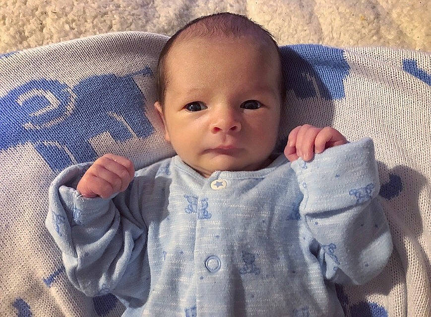 Maximilian is registered to the contest to win money with this photo: baby, baby_products, blanket, cheek, child, cool, eye, face, finger, forehead, hand, head, iris, lip, mouth, nose, person, product, skin, textile