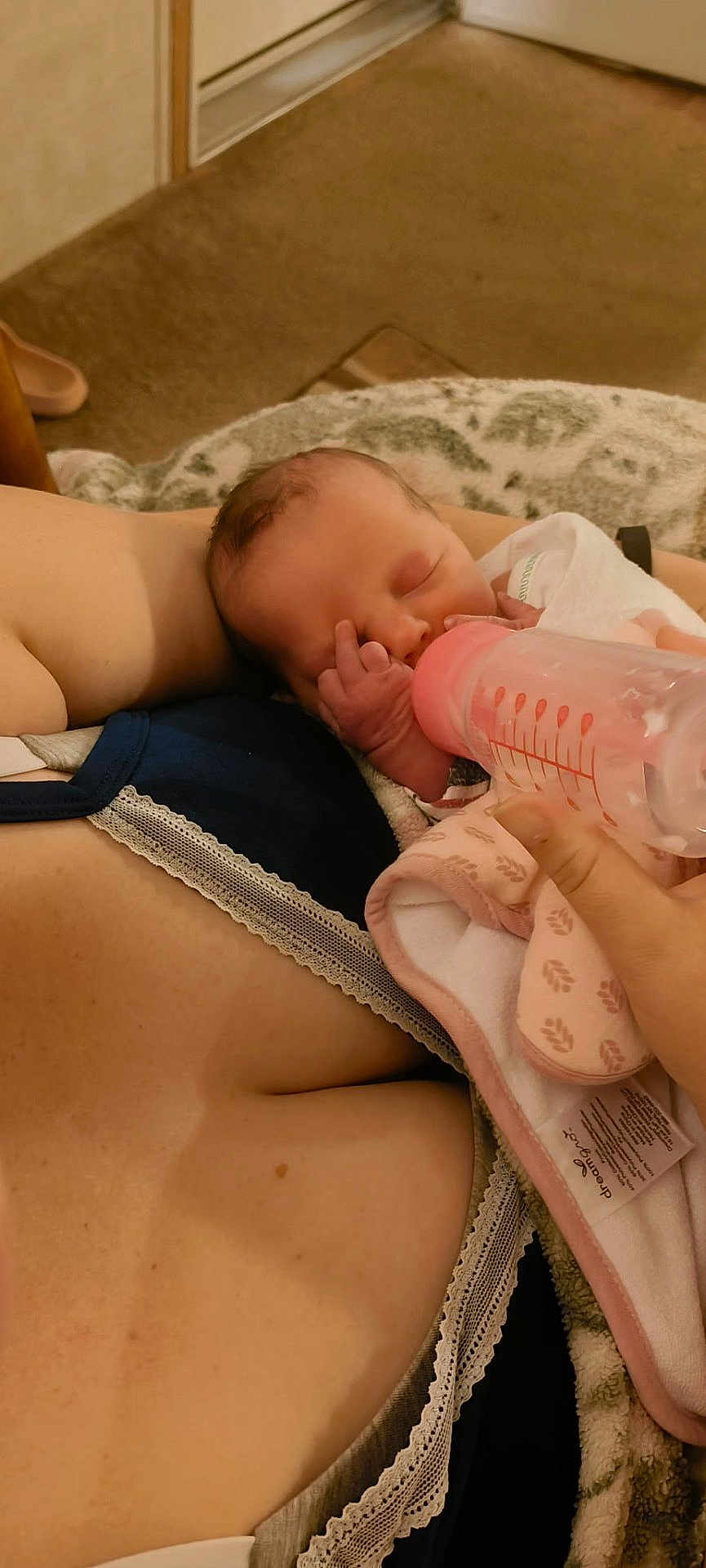 Haisley joined the competition — help win amazing prizes! newborn, baby, bottle, feeding, arms, blanket, sleeping, infant, person, hand, clothing, bedroom, carpet, comfort, rest, care, closeup, skin, nap, peaceful