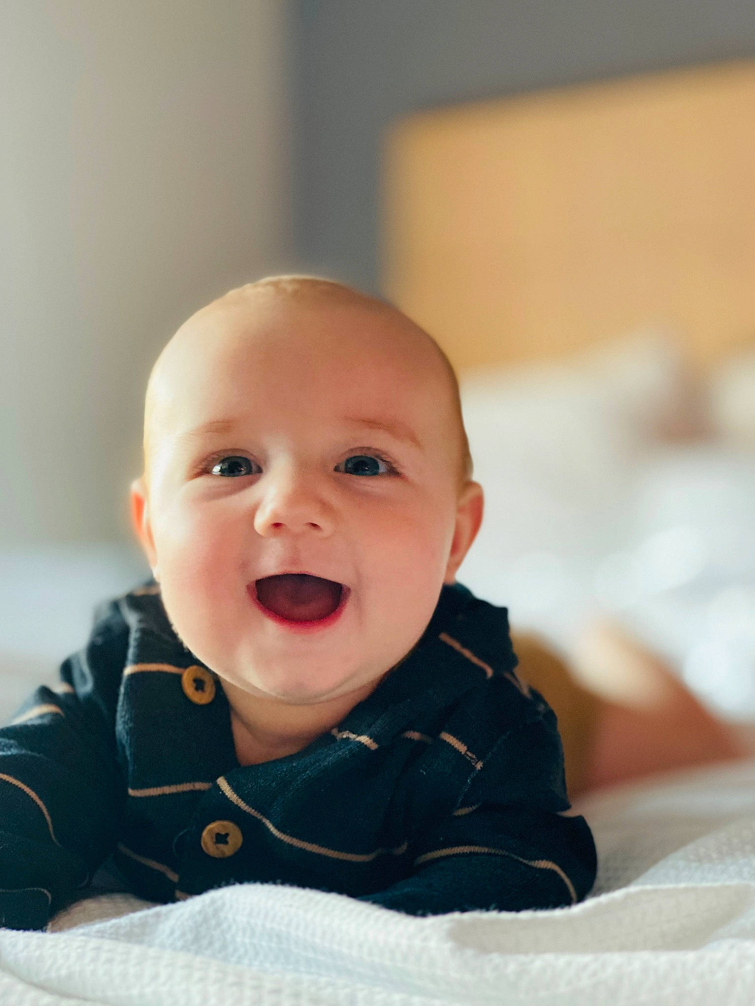 Maxton is registered to the contest to win money with this photo: baby, baby_toddler_clothing, carmine, cheek, child, chin, collar, comfort, eye, fun, happy, iris, jacket, person, portrait_photography, room, sitting, skin, sleeve, smile