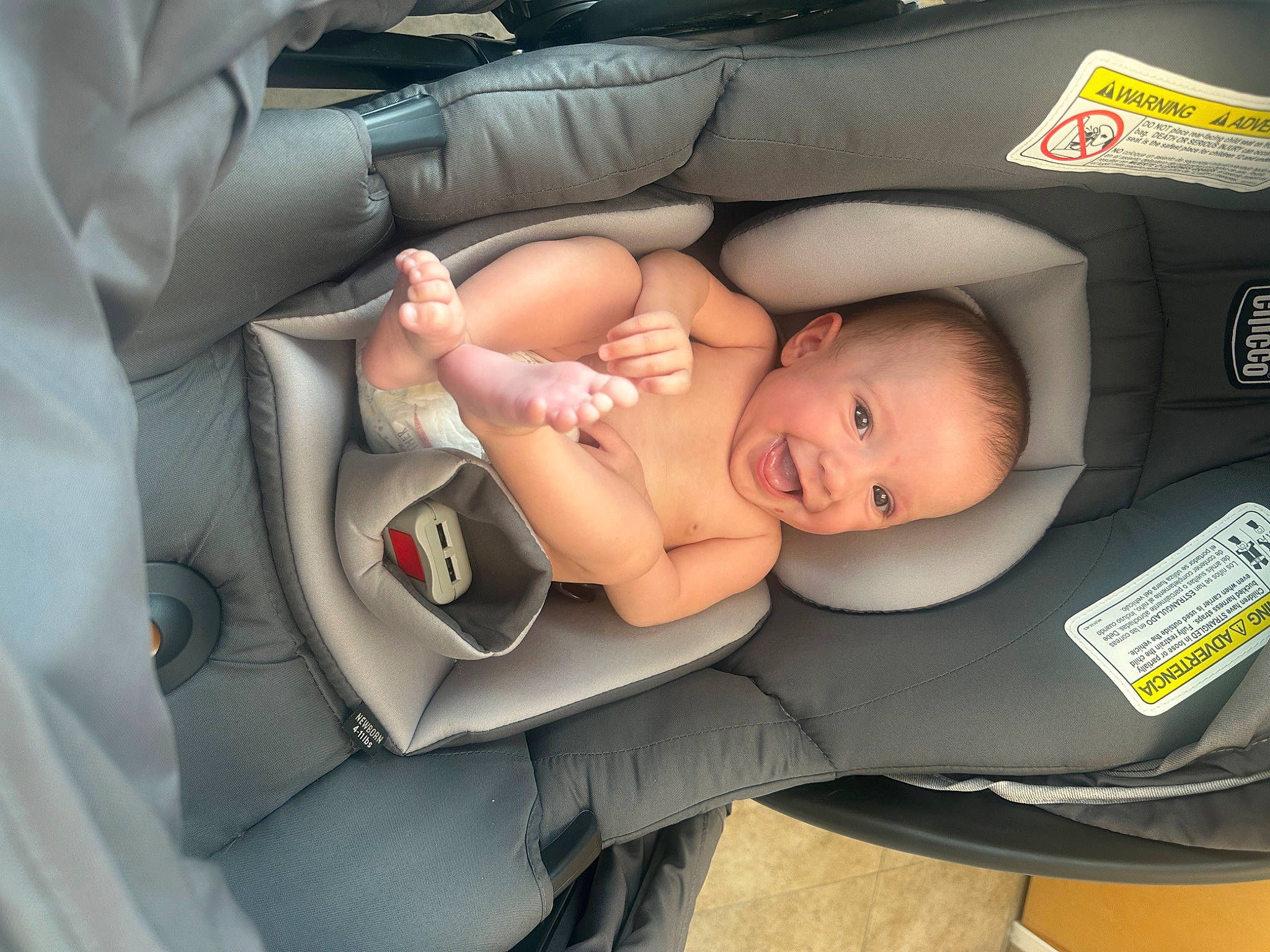 Rosalyn is registered to the contest to win money with this photo: auto_part, automotive_design, baby, baby_carriage, baby_in_car_seat, baby_products, baby_safety, baby_sleeping, baby_toddler_clothing, car_seat, carmine, child, comfort, finger, nail, person, personal_protective_equipment, service, sitting, toddler