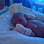 newborn, baby, hospital, incubator, medical_equipment, blanket, mitten, sleeping, patient, infant, healthcare, monitoring, bed, blue_light, cute, fragile, resting, child, person, care