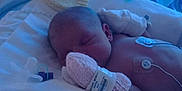 Gypsi-Ami is registered to the contest to win money with this photo: newborn, baby, incubator, hospital, sleeping, blanket, mitten, patient, medical, healthcare, infant, nursery, soft_light, hospital_bed, monitoring, peaceful, resting, child, cute, tiny