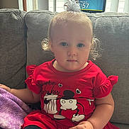 Riley joined the competition — help win amazing prizes! toddler, child, red_dress, hair_bow, couch, blanket, indoor, digital_device, curtains, window, cartoon_character, sitting, portrait, cute, baby, person, furniture, clothing, face, expression