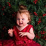 Ysalia participe au concours pour gagner de l'argent avec cette photo : baby, berries, celebration, child, christmas, curly_hair, cute, dress, festive, greenery, hands, happy, holiday, indoor, pine_branches, playful, portrait, red_dress, smiling, toddler
