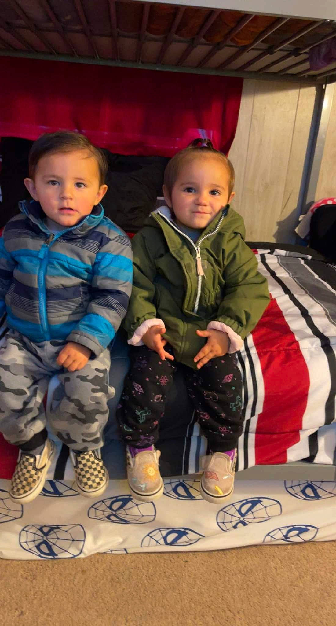 Alan is registered to the contest to win money with this photo: baby, baby_toddler_clothing, backpack, bag, baggage, cheek, child, curtain, event, flooring, fun, happy, luggage_and_bags, pattern, person, room, sitting, sleeve, sock, toddler