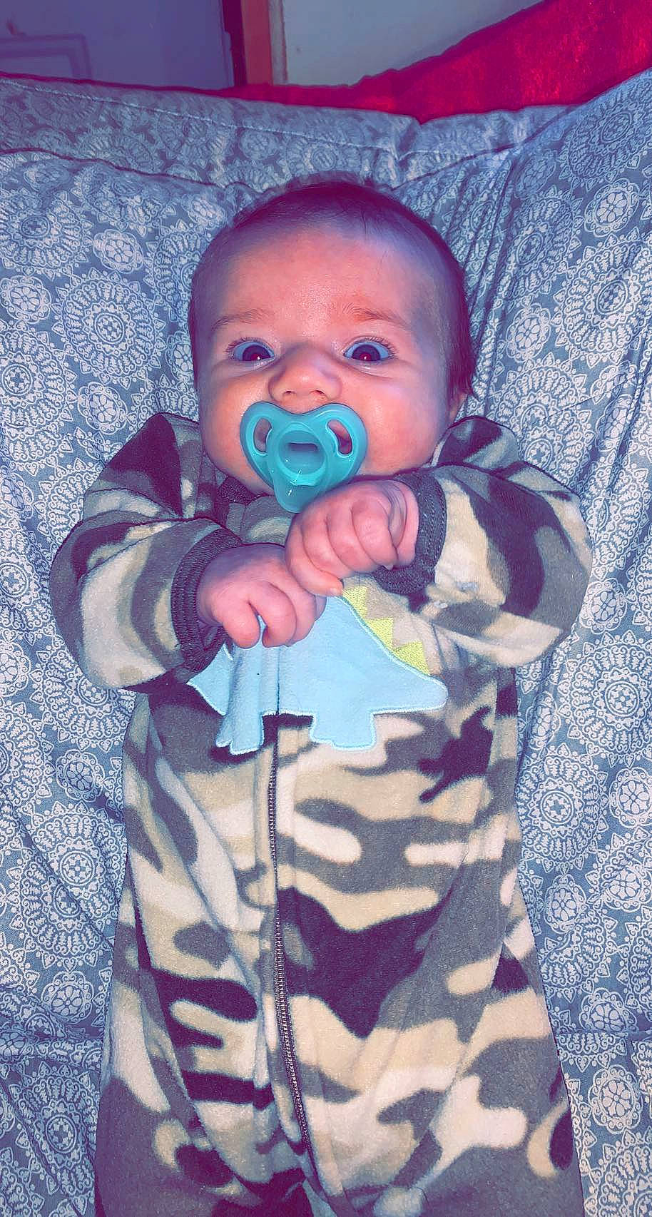 Korbyn joined the competition — help win amazing prizes! baby_toddler_clothing, blue, camouflage, cheek, eye, face, facial_expression, gesture, hand, head, human_body, iris, lip, mouth, nose, organ, person, purple, skin, sleeve