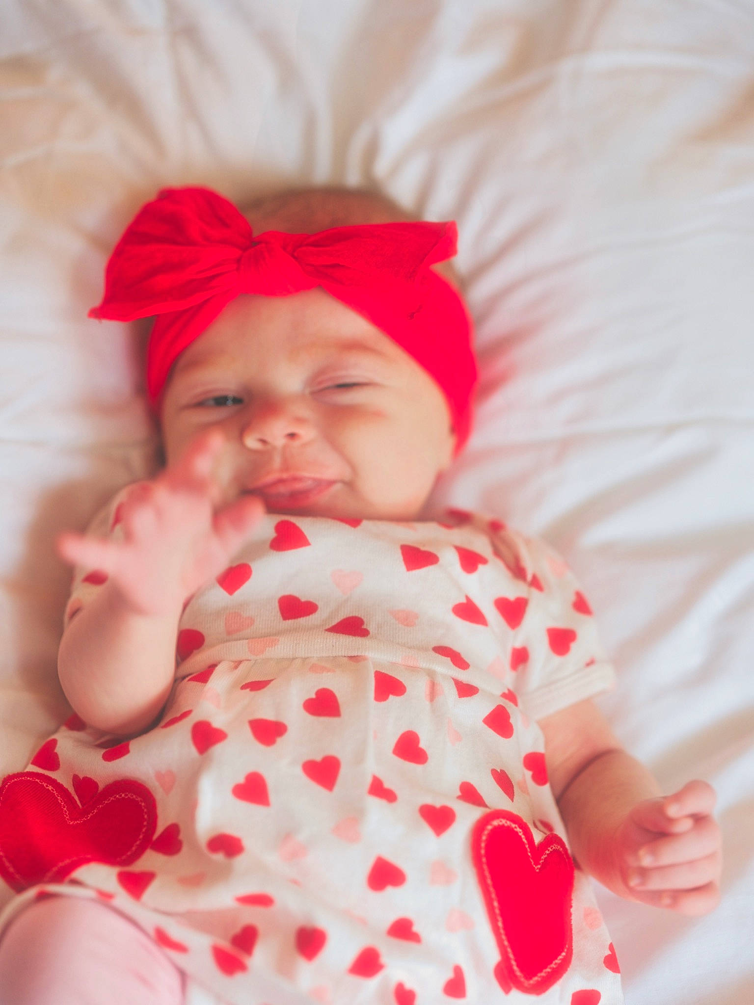 Lakelynn is registered to the contest to win money with this photo: baby, baby_products, baby_sleeping, baby_toddler_clothing, carmine, chin, comfort, face, happy, headwear, linens, lip, mouth, nose, pattern, person, pink, skin, sleeve, smile