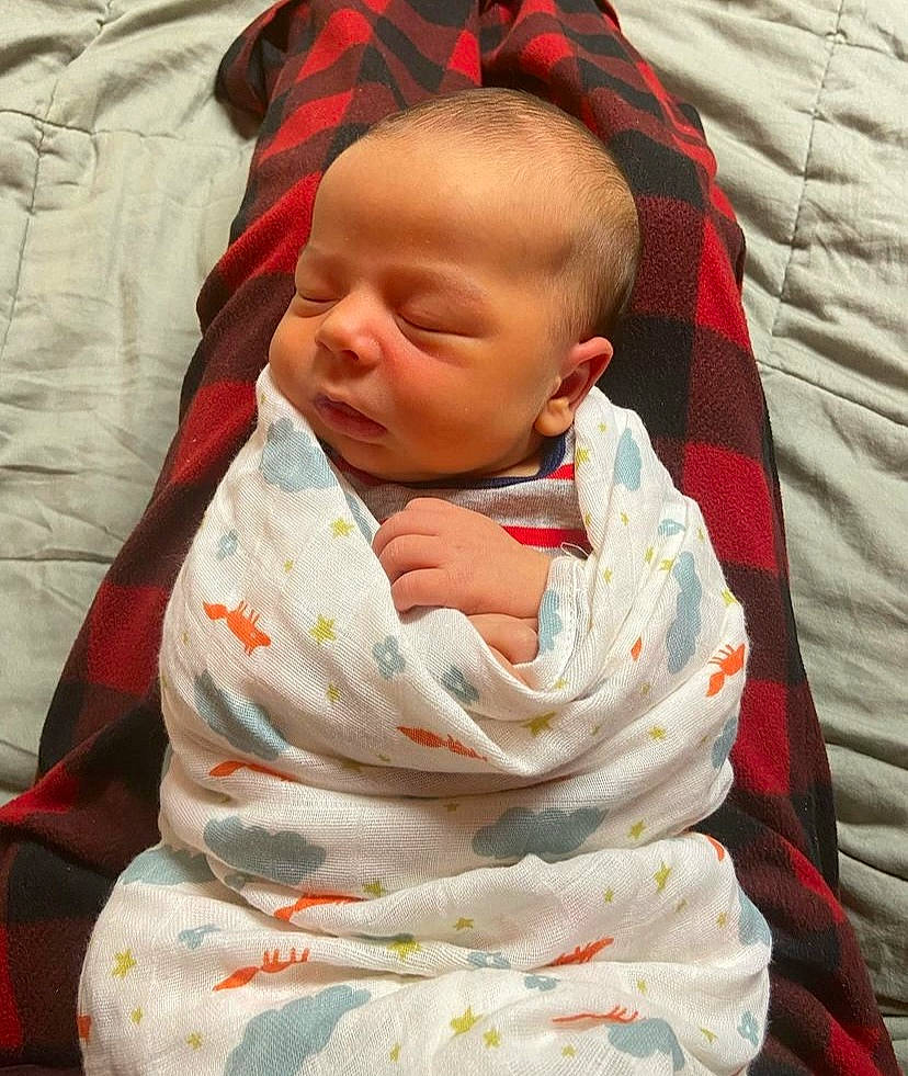 Declan is registered to the contest to win money with this photo: baby, baby_products, baby_safety, baby_sleeping, baby_toddler_clothing, bedtime, carmine, cheek, child, chin, collar, comfort, face, head, linens, pattern, person, sitting, skin, sleeve