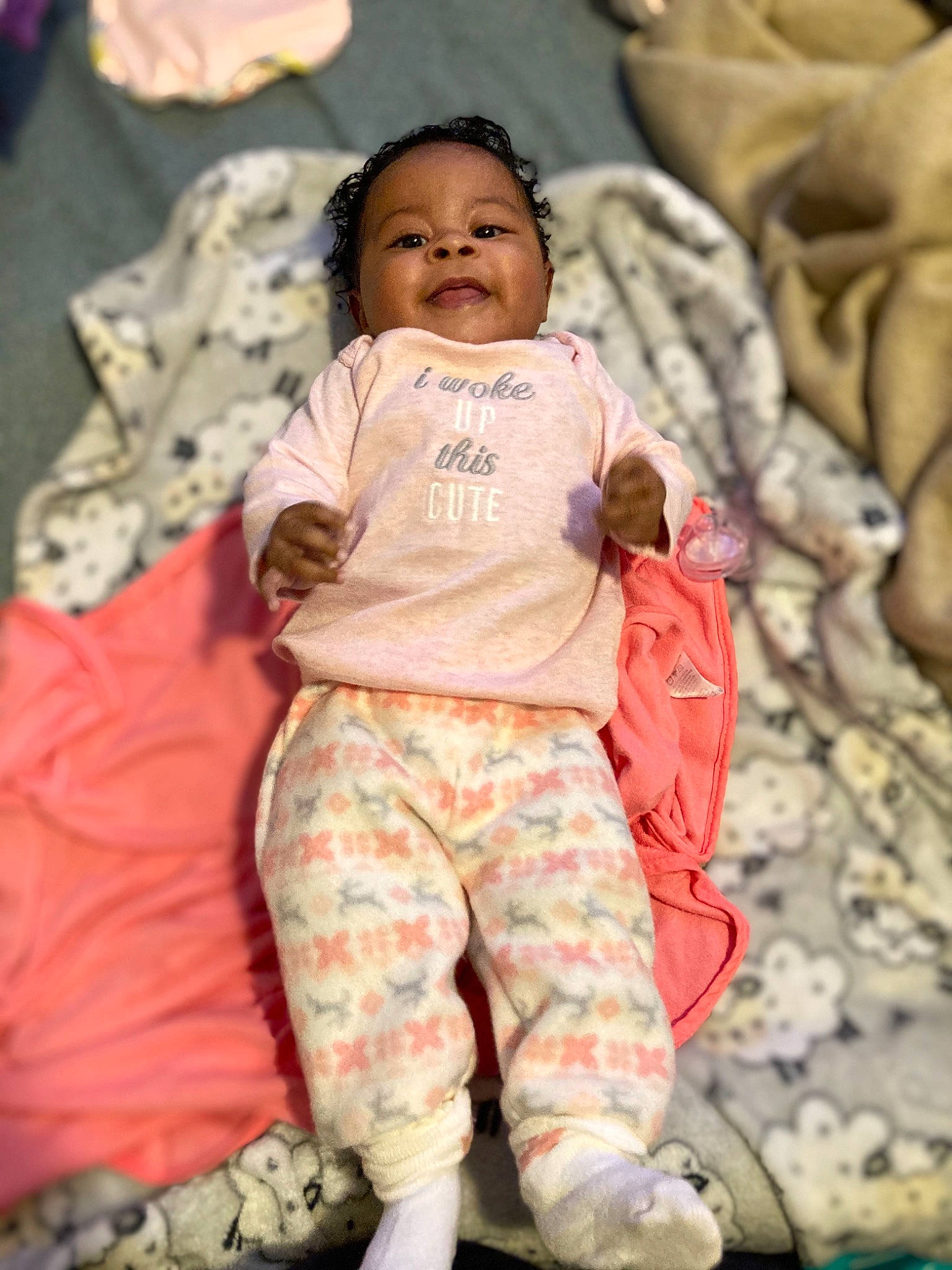 Clarissa joined the competition — help win amazing prizes! baby, baby_toddler_clothing, child, comfort, event, face, fun, happy, head, linens, military_camouflage, pattern, person, pink, sitting, skin, sleeve, smile, t_shirt, textile