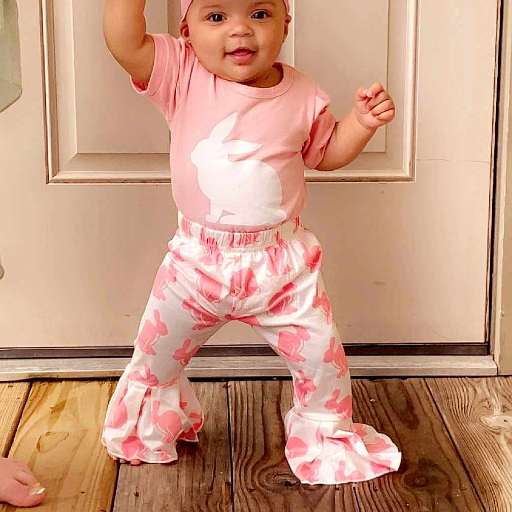 Zayleigh joined the competition — help win amazing prizes! baby, cap, clothing, door, face, footwear, hardwood, hat, head, indoors, interiordesign, pajamas, pants, person, photography, portrait, shoe, sleeve, stainedwood, wood