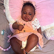 Kehlani is registered to the contest to win money with this photo: accessories, baby, bracelet, clothing, couch, cushion, face, furniture, happy, hat, head, homedecor, jewelry, necklace, person, photography, portrait, shorts, sitting, smile