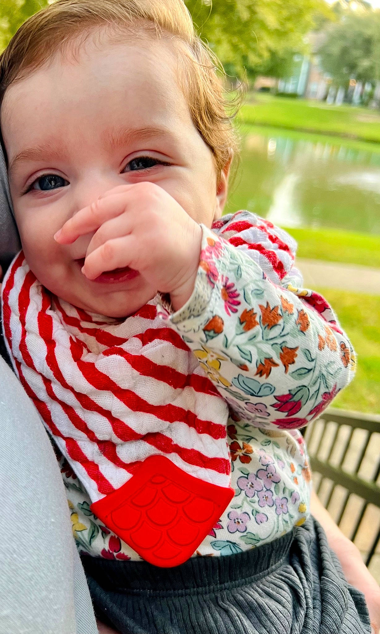 Aisha is registered to the contest to win money with this photo: baby, baby_toddler_clothing, cheek, child, fun, grass, green, happy, iris, lake, leisure, lip, pattern, people_in_nature, person, plaid, portrait_photography, sitting, sleeve, toddler