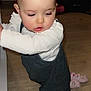 toddler, child, baby, overalls, socks, floor, wooden_floor, indoor, curious, exploring, person, clothing, long_sleeve, standing, young_child, skin, head, face, cute, home