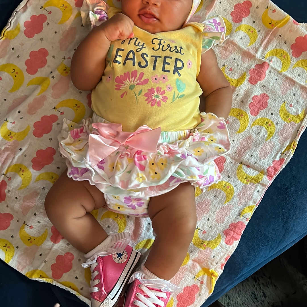 Erie joined the competition — help win amazing prizes! baby, bed, blanket, bonnet, clothing, couch, face, footwear, furniture, hat, head, newborn, person, photography, portrait, shoe, shorts, sitting, sleeping, t_shirt