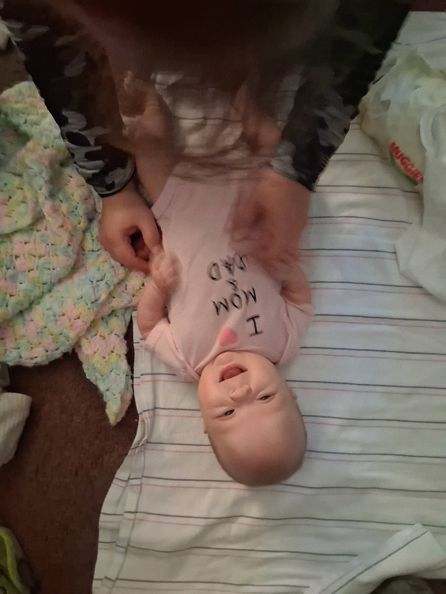 Delilah joined the competition — help win amazing prizes! baby, babycare, bedroom, blanket, blur, carpet, clothing, crawling, cute, family, hands, happy, indoor, infant, joy, parent, person, playful, smiling, striped