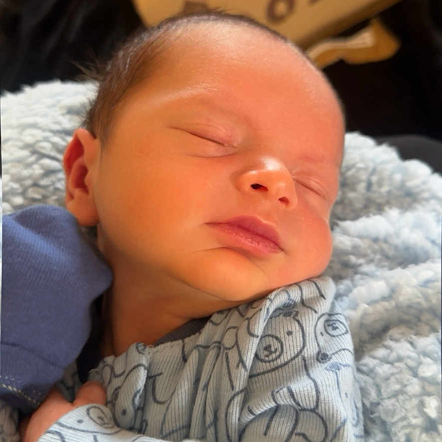 Damien joined the competition — help win amazing prizes! newborn, baby, sleeping, infant, blanket, blue, cozy, patterned_clothing, closeup, portrait, peaceful, soft_light, human, child, cute, resting, indoors, skin, head, face