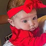 Indigo is registered to the contest to win money with this photo: baby, child, infant, portrait, face, eyes, red_outfit, headband, bow, clothing, cuddling, adult, indoor, close_up, sitting, happy, cute, photography, family, fashion